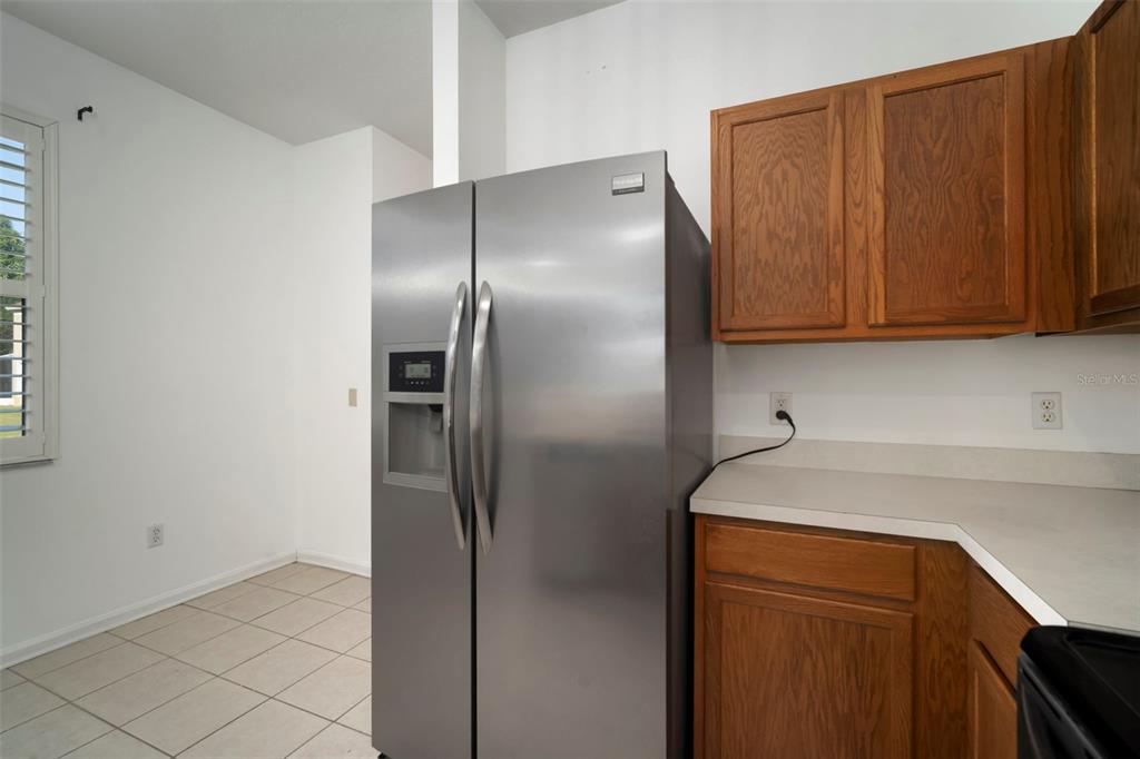 2802 Conch Hollow Drive Brandon, FL 33511 - Photo 25 of 74 a kitchen with metallic refrigerator freezer and a dishwasher