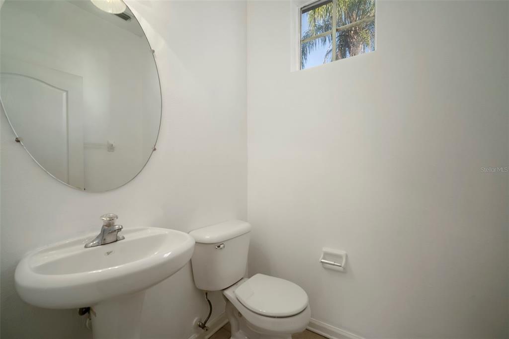 2802 Conch Hollow Drive Brandon, FL 33511 - Photo 28 of 74 a bathroom with a sink mirror and toilet