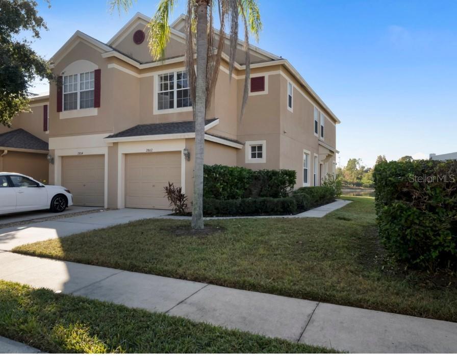 2802 Conch Hollow Drive Brandon, FL 33511 - Photo 49 of 74 a front view of a house with a yard and garage