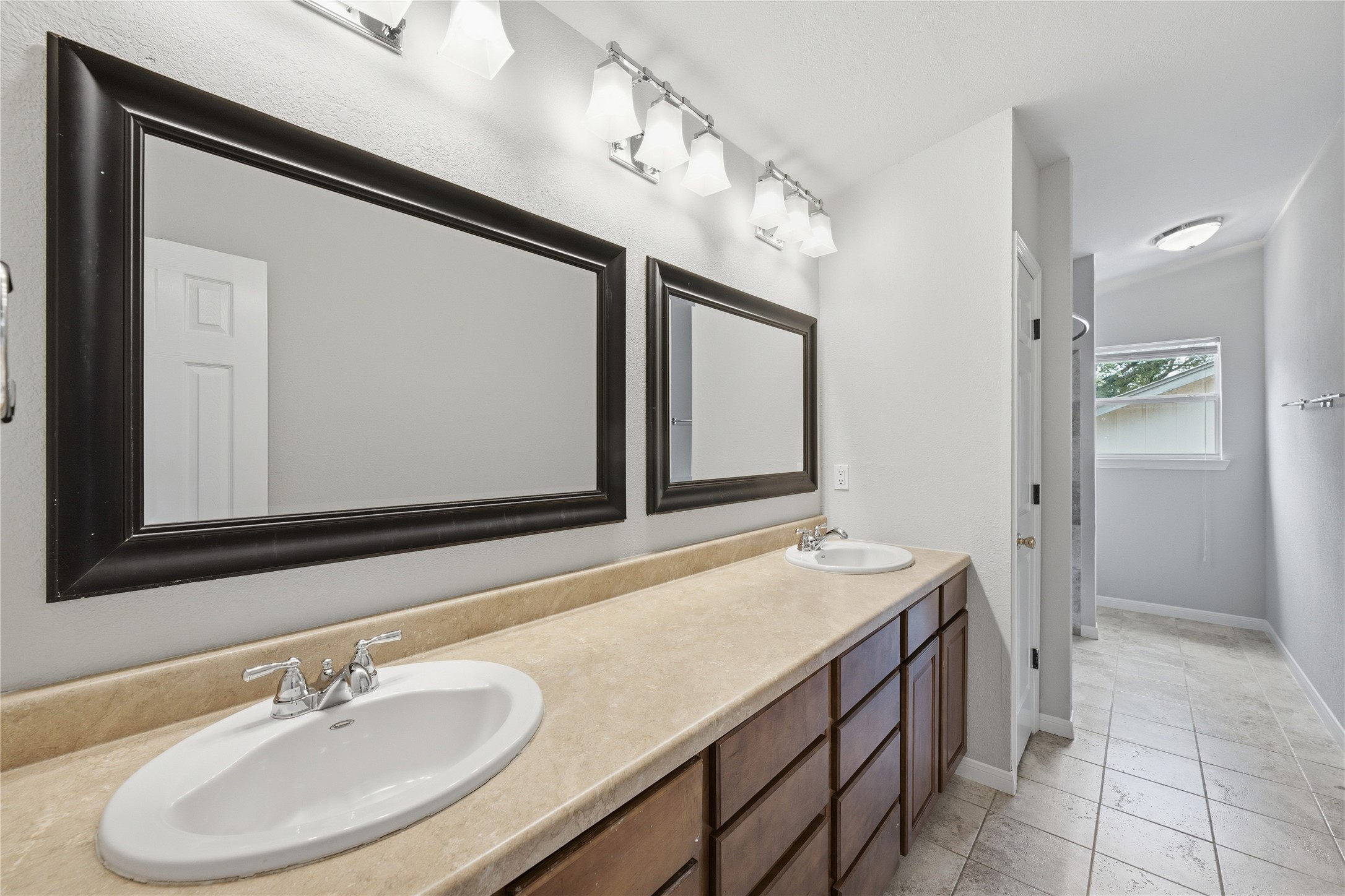 1317 Mimosa Pass Cedar Park, TX 78613 - Photo 12 of 20 a bathroom with a sink and a mirror