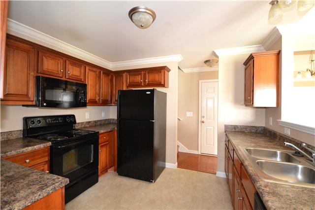 1027 Golf View Way Spring Hill, TN 37174 - Photo 8 of 19 Kitchen Has Plenty of Cabinets and A Large Pantry