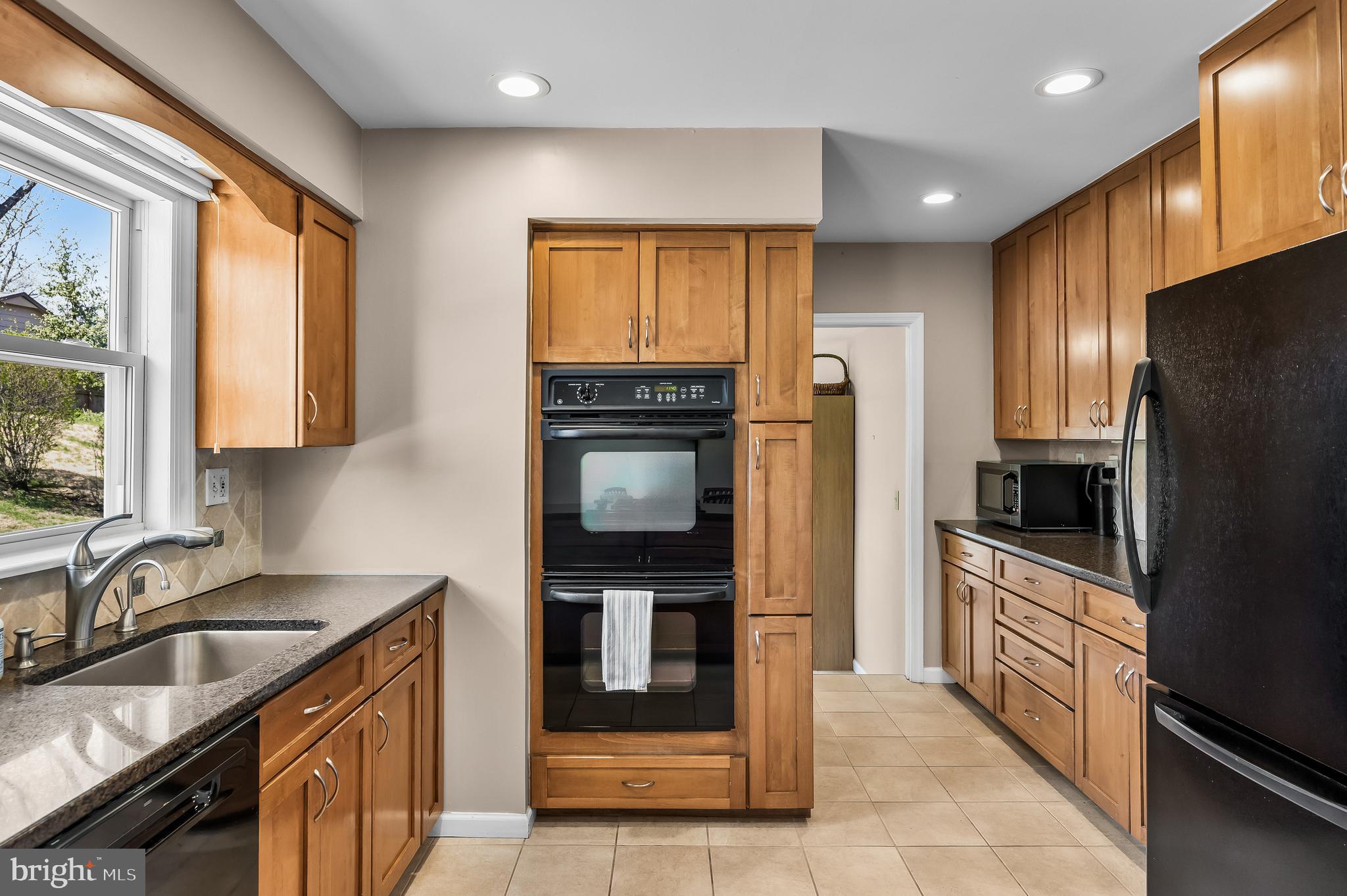 1003 Roumfort Avenue Cherry Hill, NJ 08034 - Photo 14 of 37 a kitchen with granite countertop a refrigerator and a sink