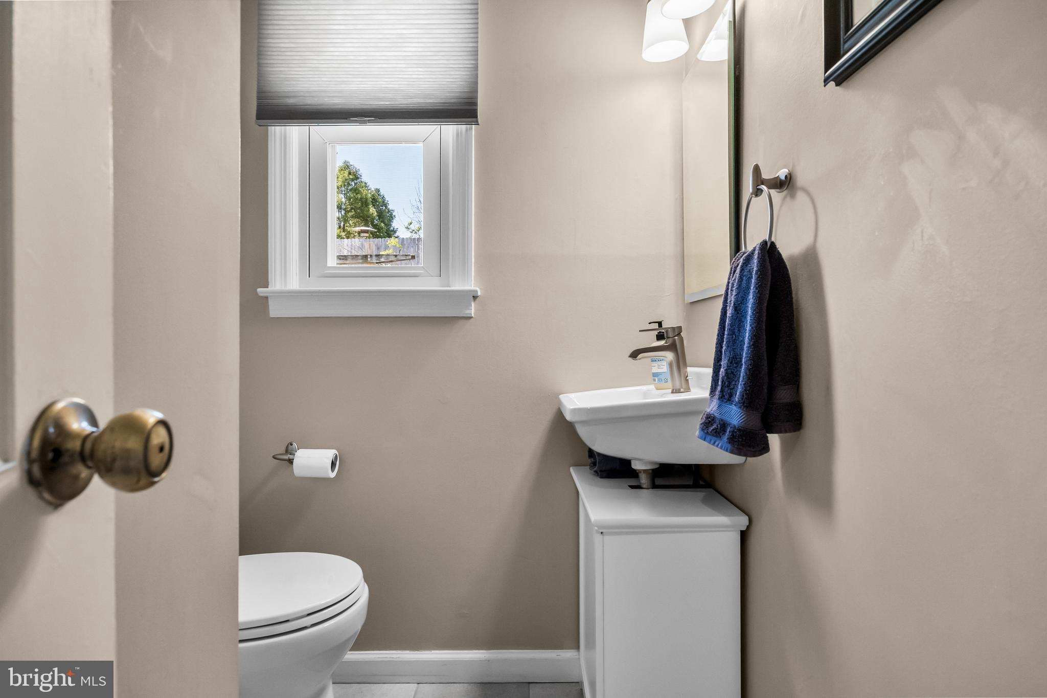 1003 Roumfort Avenue Cherry Hill, NJ 08034 - Photo 17 of 37 a bathroom with a toilet sink and mirror