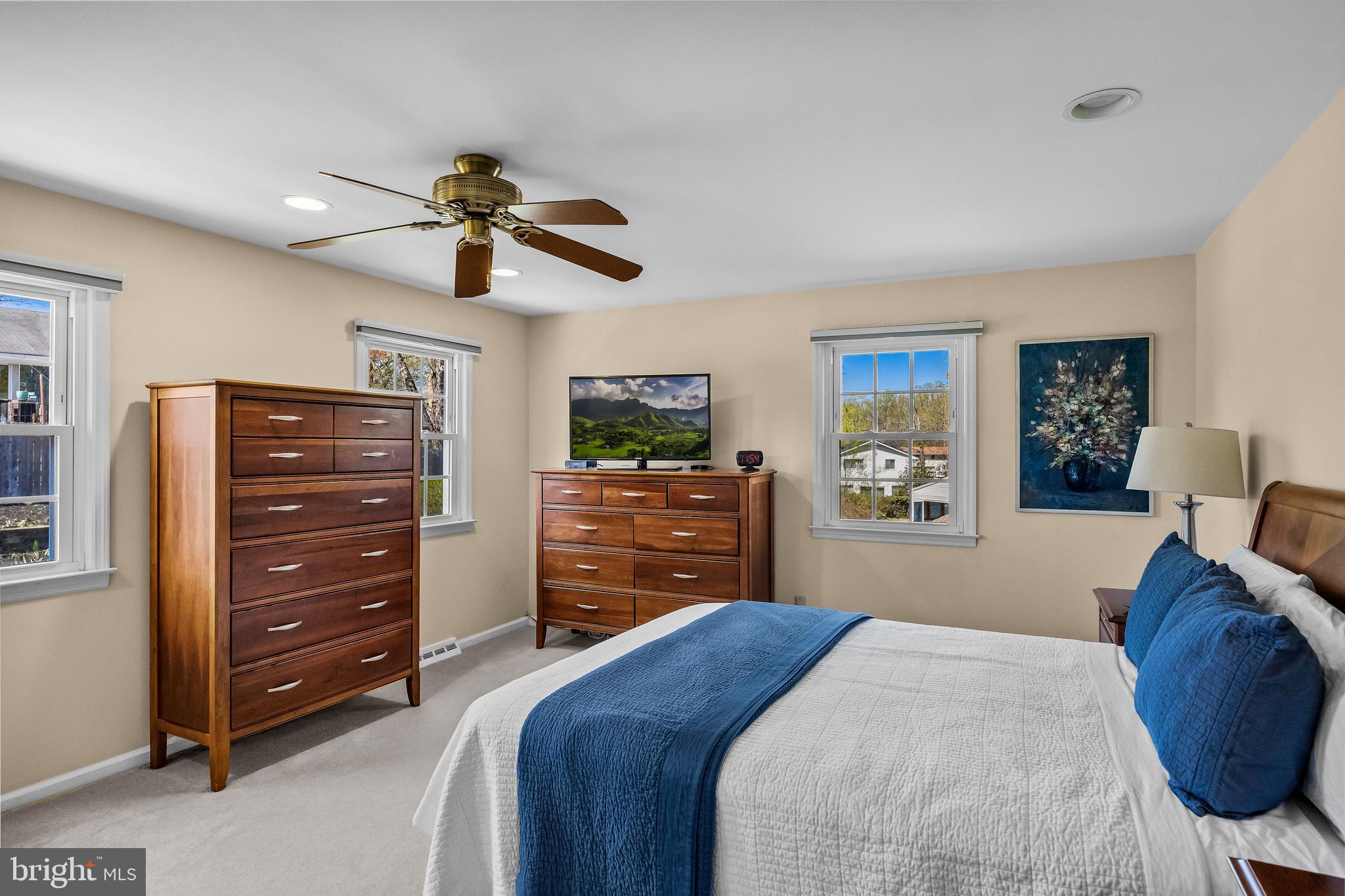 1003 Roumfort Avenue Cherry Hill, NJ 08034 - Photo 21 of 37 a bedroom with a bed a dresser and a chandelier