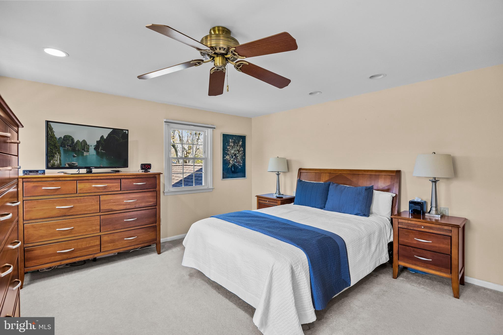 1003 Roumfort Avenue Cherry Hill, NJ 08034 - Photo 22 of 37 a bedroom with a bed and a chandelier