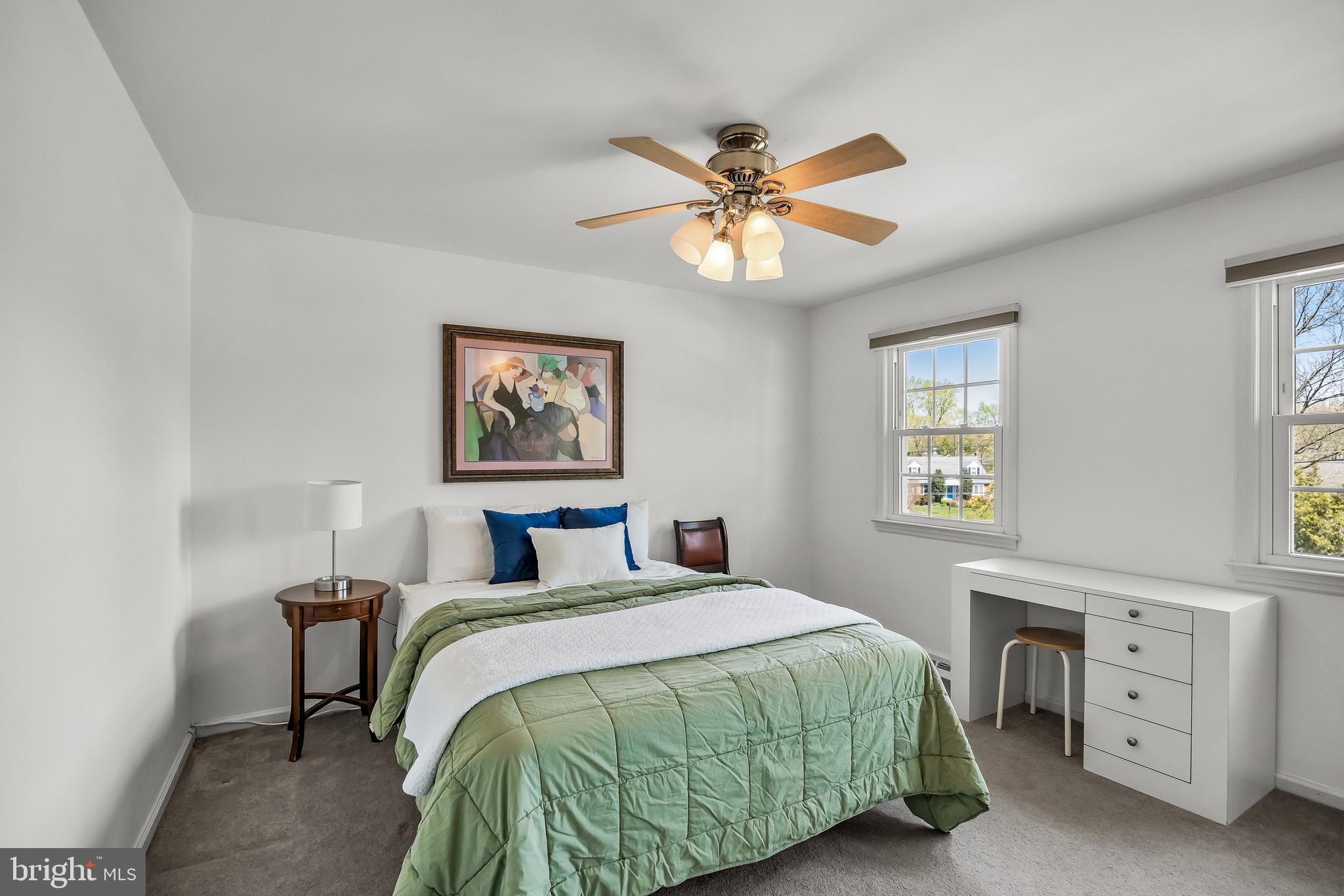 1003 Roumfort Avenue Cherry Hill, NJ 08034 - Photo 25 of 37 a bedroom with a bed and a chandelier