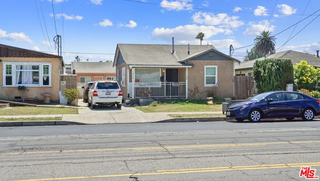 a view of a car parked in front of a house