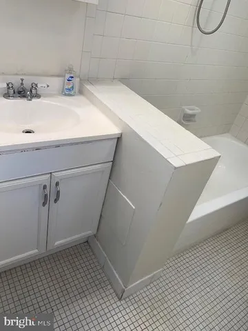 a bathroom with a sink and shower
