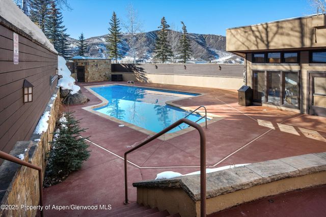 a view of a balcony with sitting area