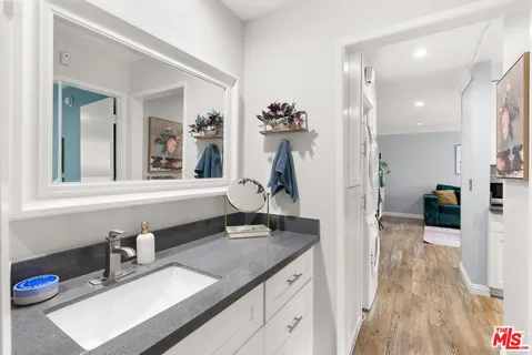 a bathroom with a sink a vanity and a mirror