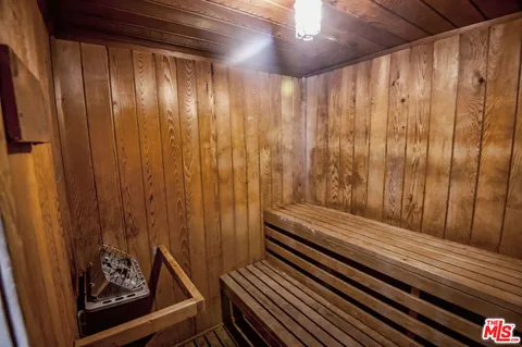 a view of a room with wooden walls