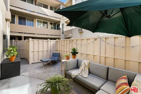 a outdoor living space with furniture and a couch