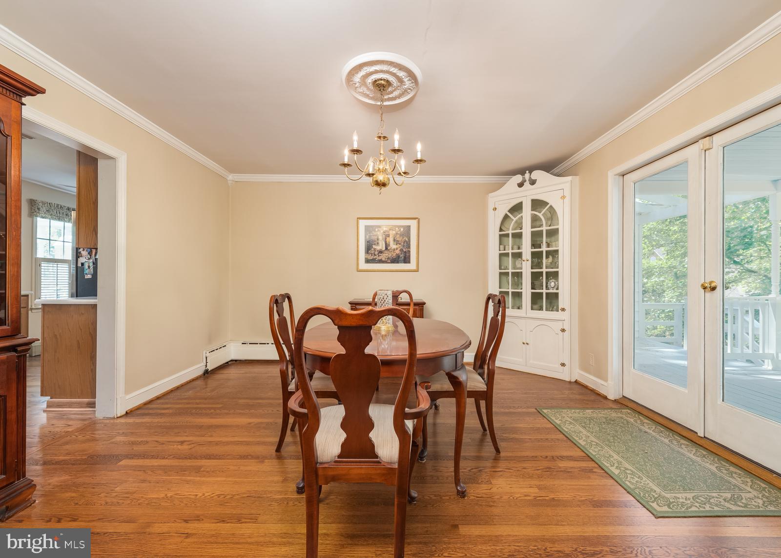 211 Patuxent Road Laurel, MD 20707 - Photo 22 of 43 Dining room with atrium doors to covered porch