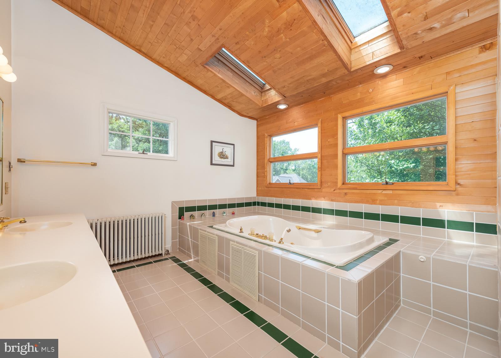 211 Patuxent Road Laurel, MD 20707 - Photo 30 of 43 Primary bathroom upper level with skylight