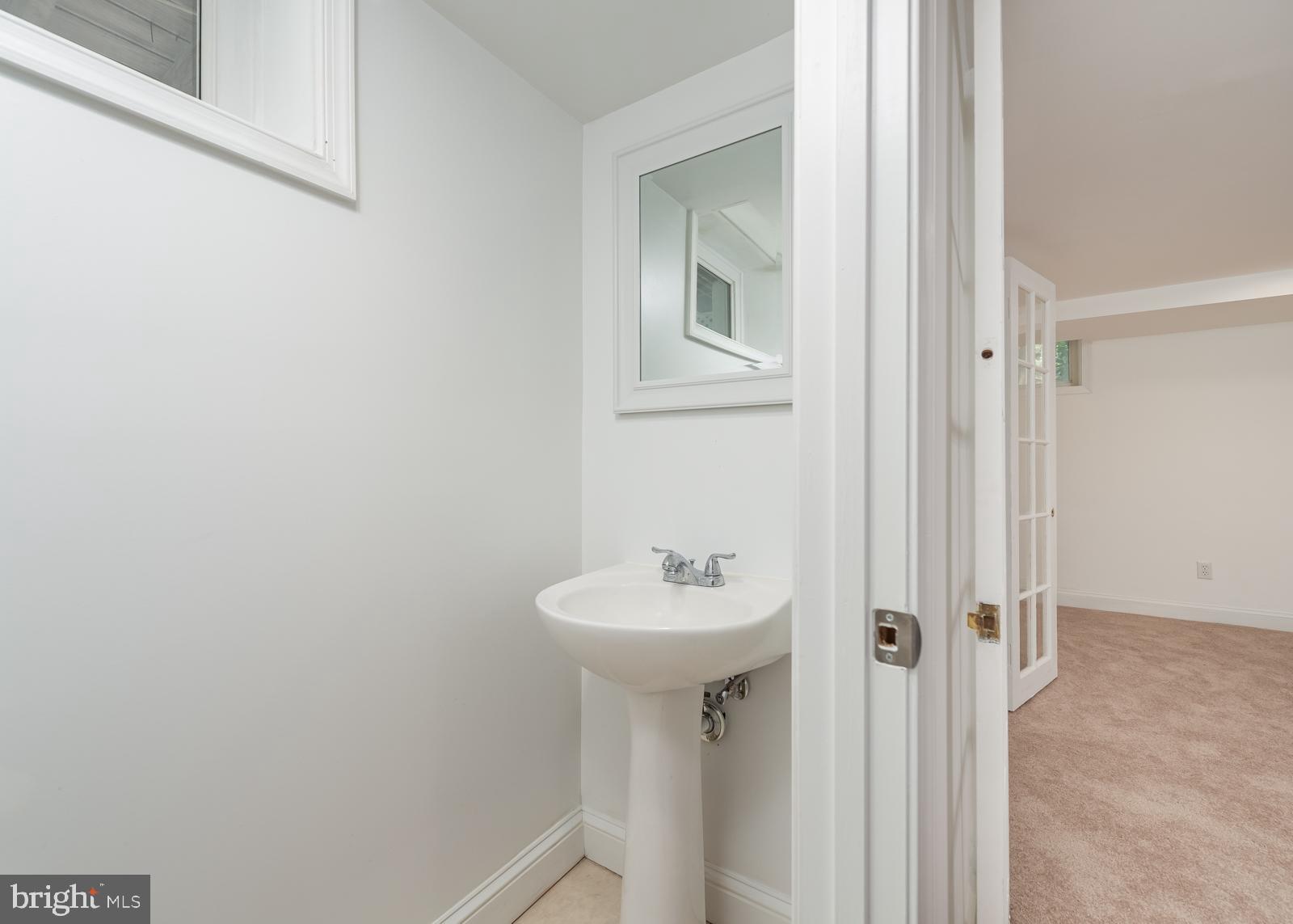 211 Patuxent Road Laurel, MD 20707 - Photo 39 of 43 Half bath in finished basement