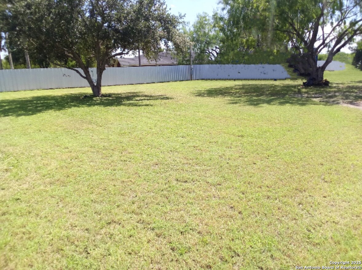 7605 North Doolittle Road Edinburg, TX 78542 - Photo 3 of 6 a view of swimming pool with a yard and large trees