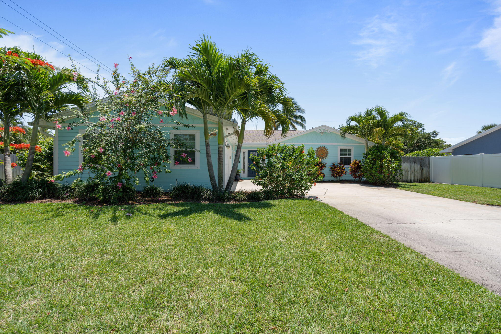 401 Surf Road Melbourne Beach, FL 32951 - Photo 1 of 94 a front view of a house with garden