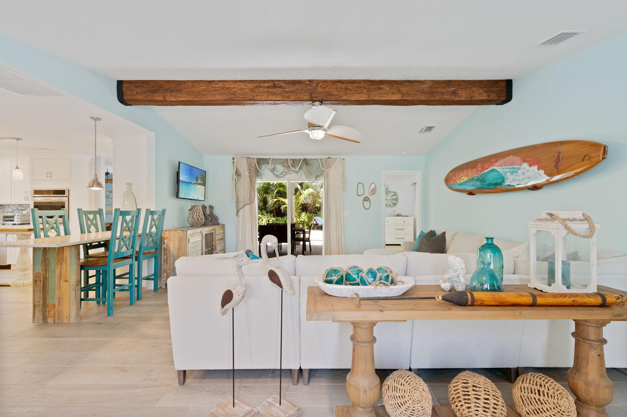 401 Surf Road Melbourne Beach, FL 32951 - Photo 11 of 94 a living room with furniture a rug and white walls