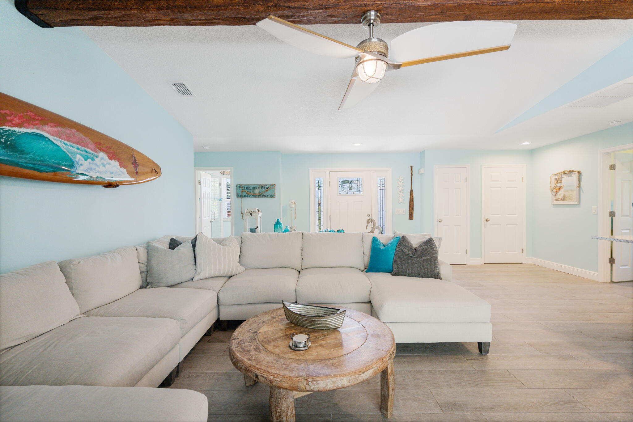 401 Surf Road Melbourne Beach, FL 32951 - Photo 12 of 94 a living room with furniture and a ceiling fan