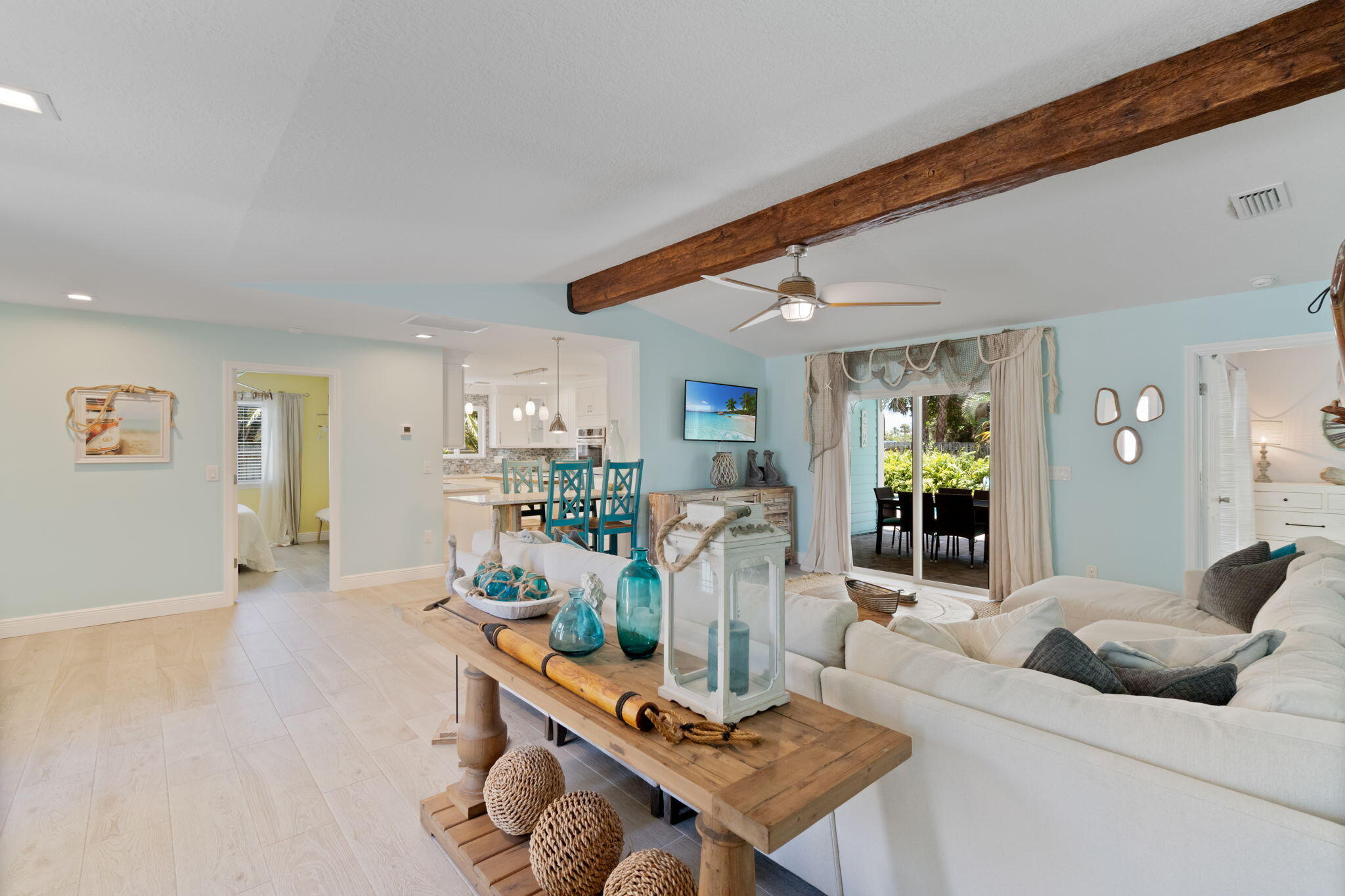 401 Surf Road Melbourne Beach, FL 32951 - Photo 16 of 94 a living room with furniture and a table