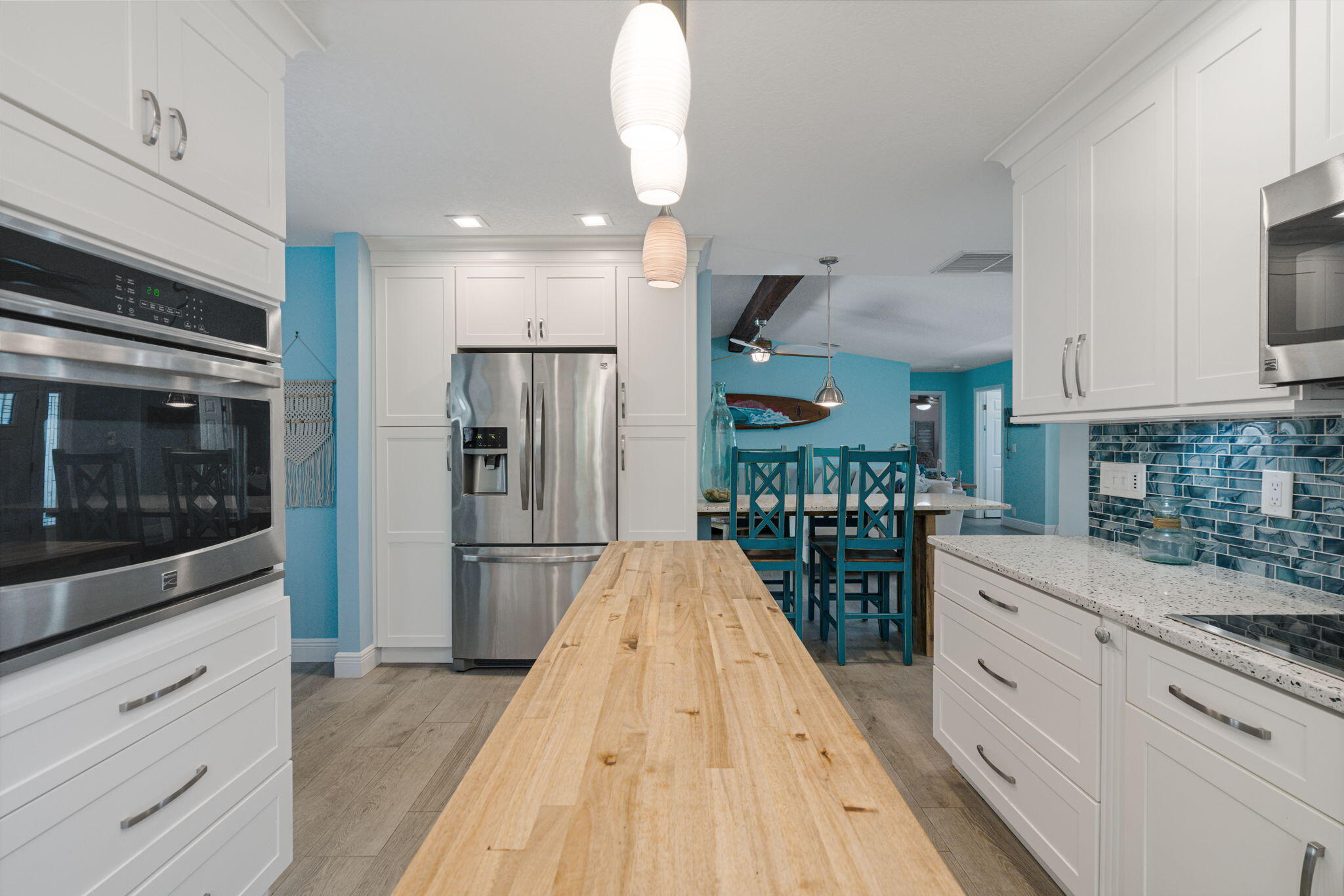 401 Surf Road Melbourne Beach, FL 32951 - Photo 21 of 94 a kitchen with stainless steel appliances granite countertop a refrigerator and a stove top oven