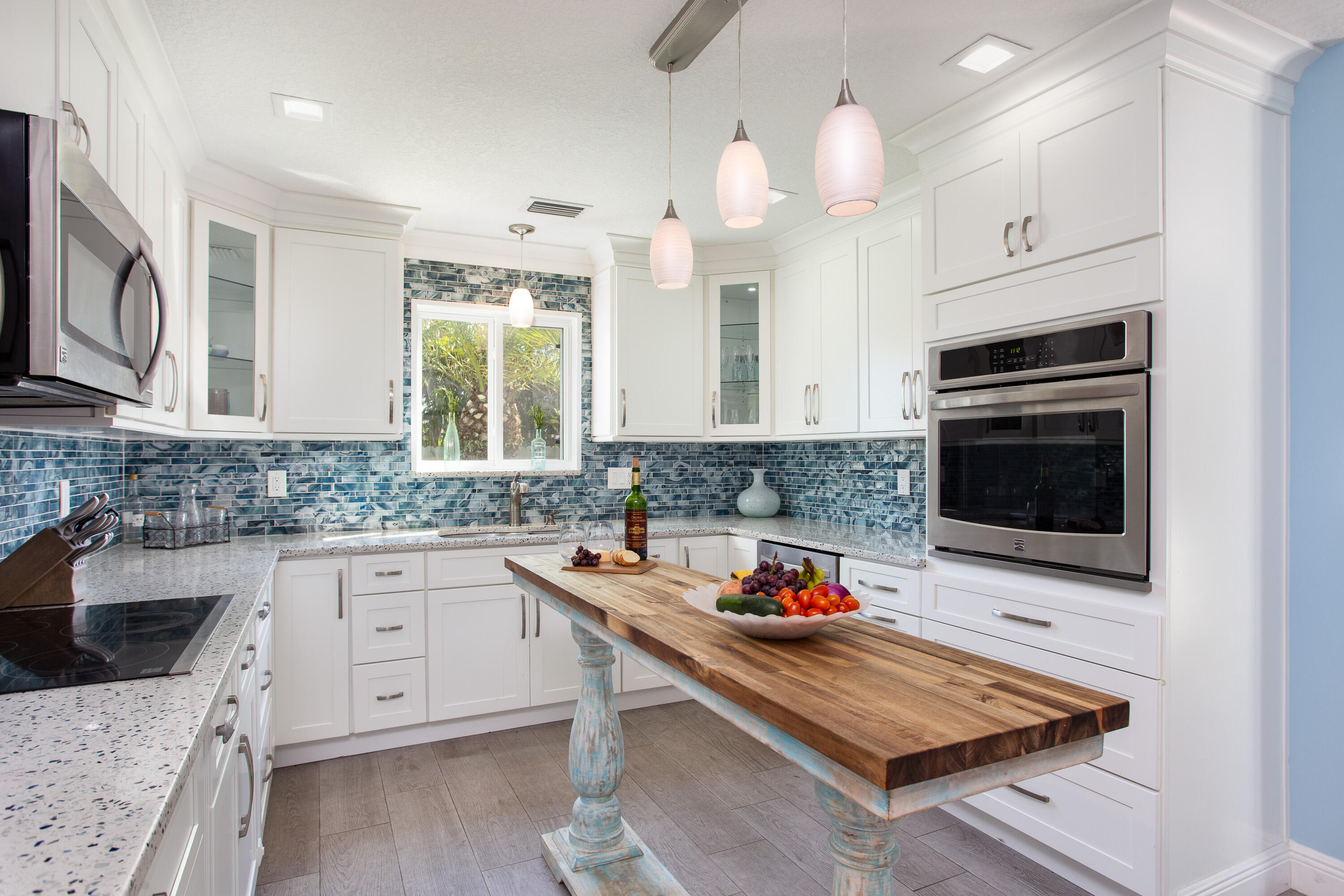 401 Surf Road Melbourne Beach, FL 32951 - Photo 24 of 94 a kitchen with stainless steel appliances kitchen island granite countertop a stove and a sink