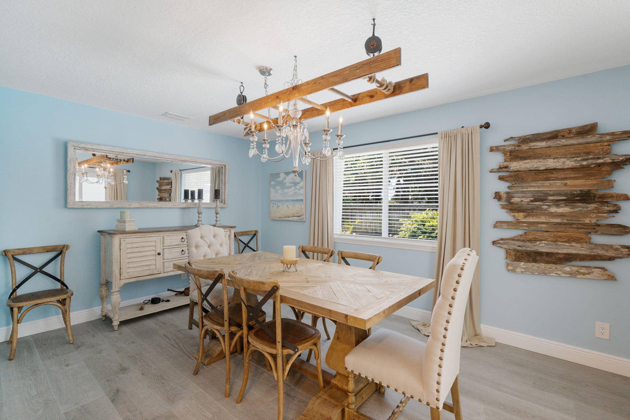 401 Surf Road Melbourne Beach, FL 32951 - Photo 29 of 94 a view of a dining room with furniture window and wooden floor