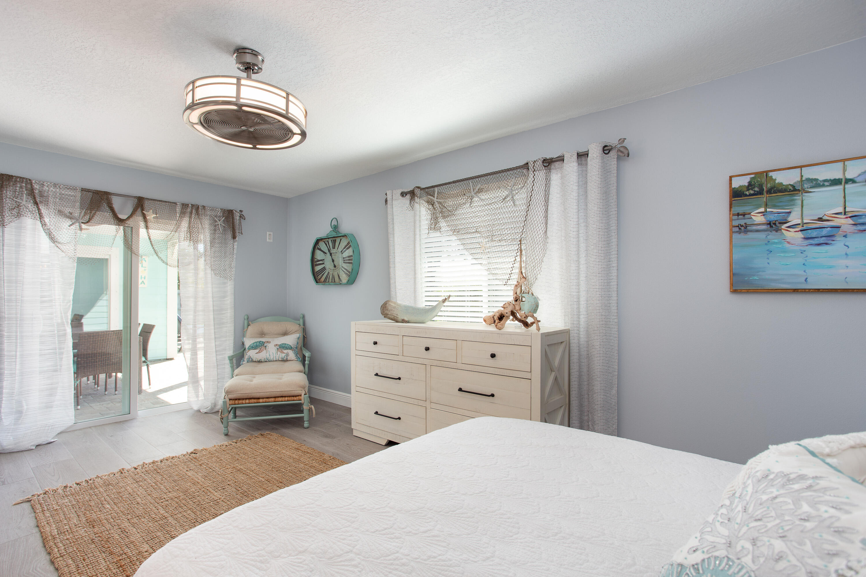 401 Surf Road Melbourne Beach, FL 32951 - Photo 33 of 94 a bedroom with a bed and window