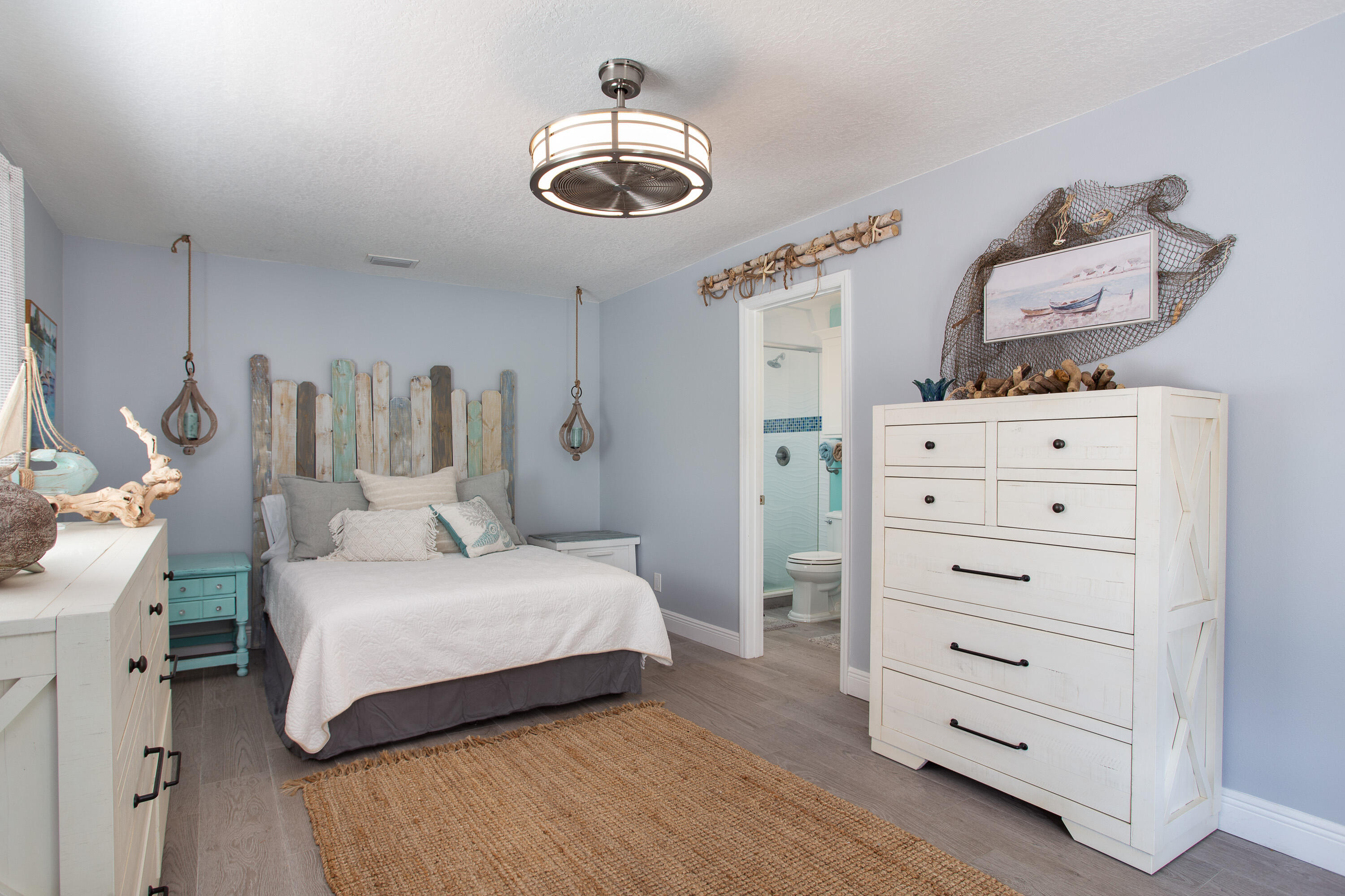401 Surf Road Melbourne Beach, FL 32951 - Photo 34 of 94 a bedroom with a bed and wooden floor