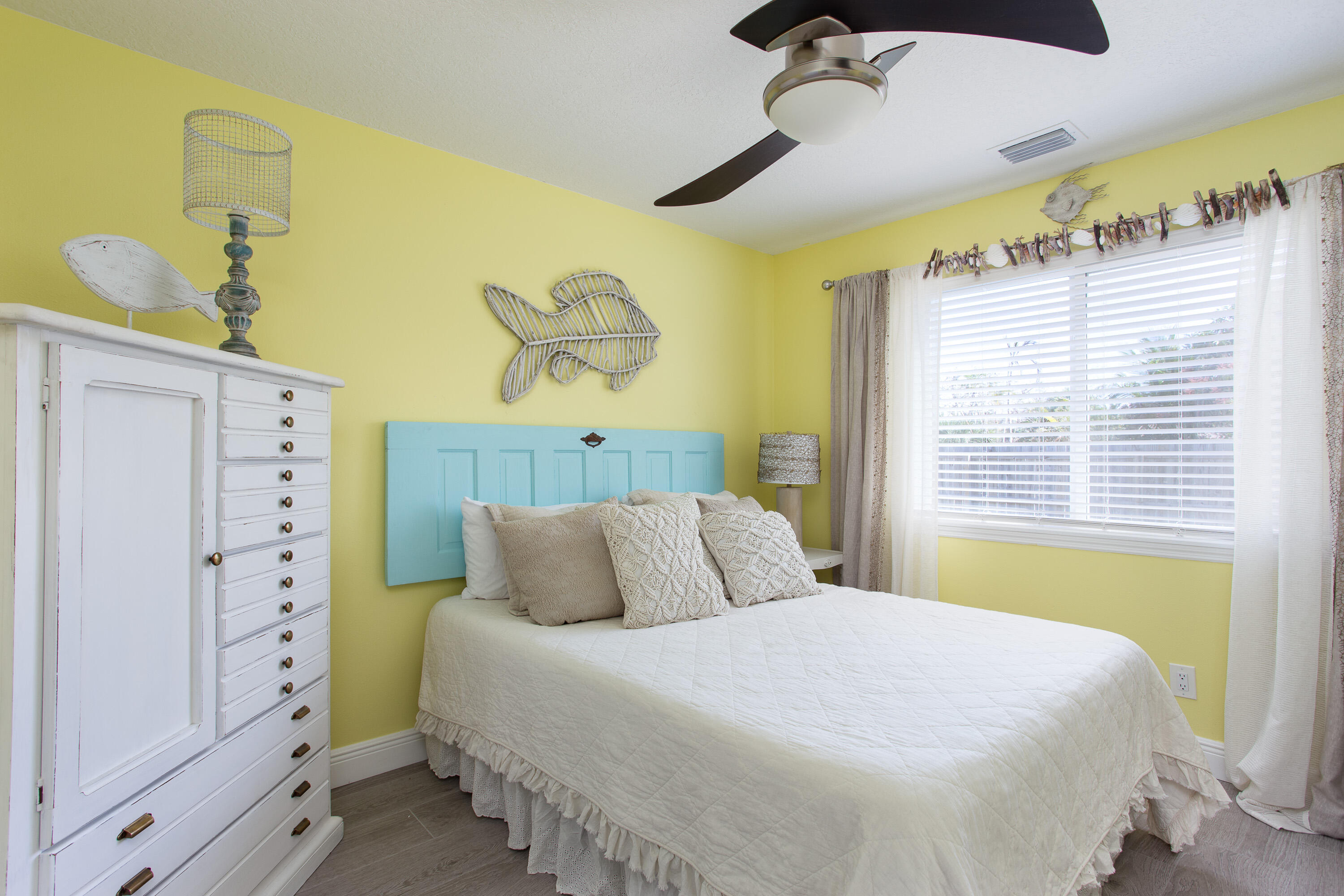401 Surf Road Melbourne Beach, FL 32951 - Photo 42 of 94 a bedroom with a bed and a window