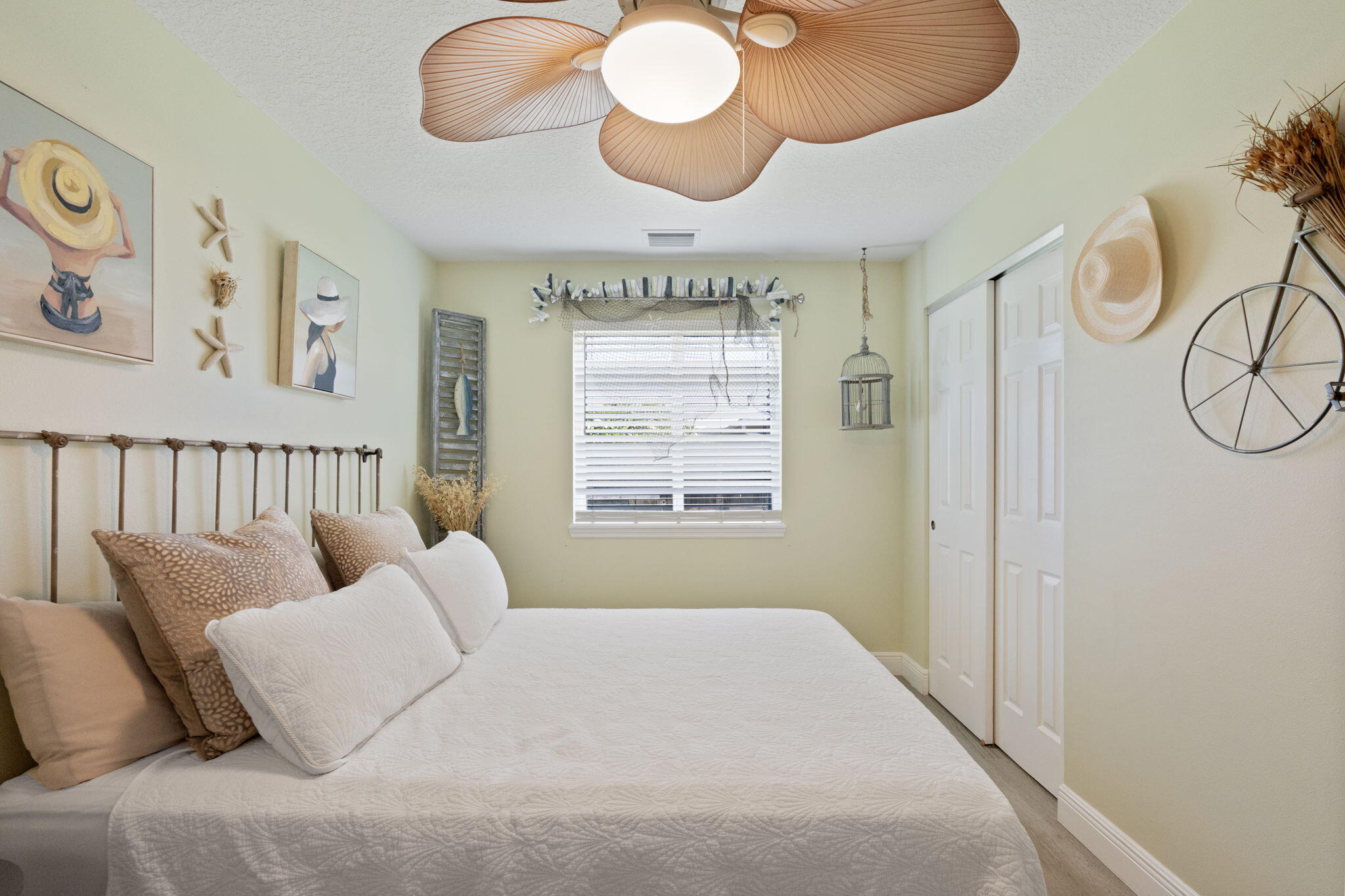 401 Surf Road Melbourne Beach, FL 32951 - Photo 47 of 94 a bedroom with furniture and a large window