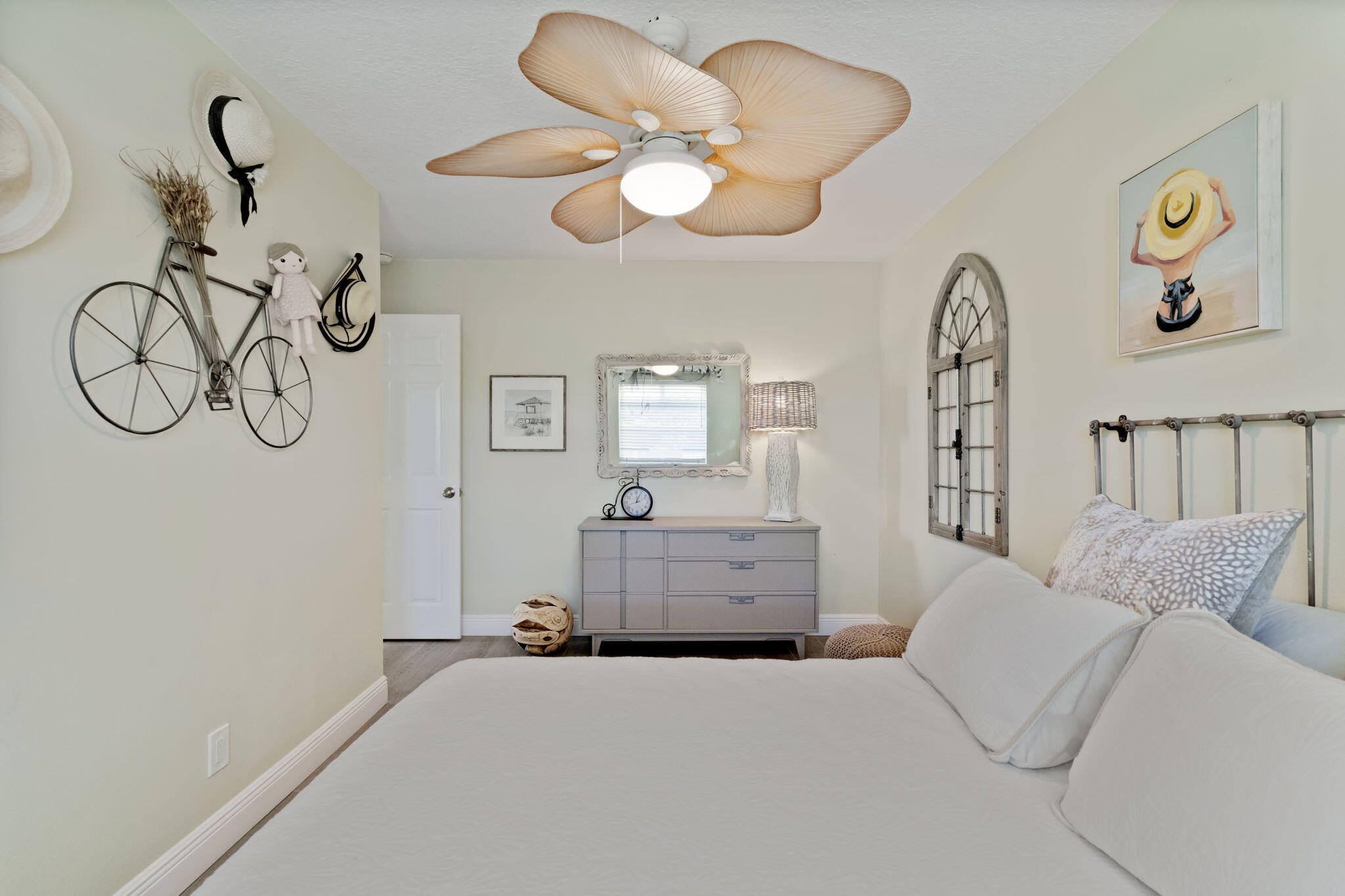 401 Surf Road Melbourne Beach, FL 32951 - Photo 48 of 94 a bedroom with a bed and a chandelier