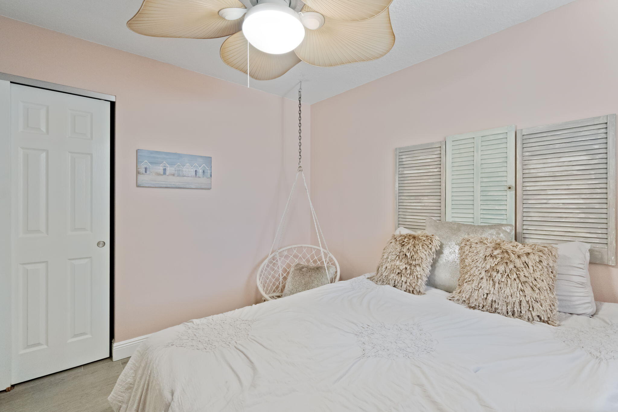 401 Surf Road Melbourne Beach, FL 32951 - Photo 51 of 94 a bedroom with a bed and a chandelier