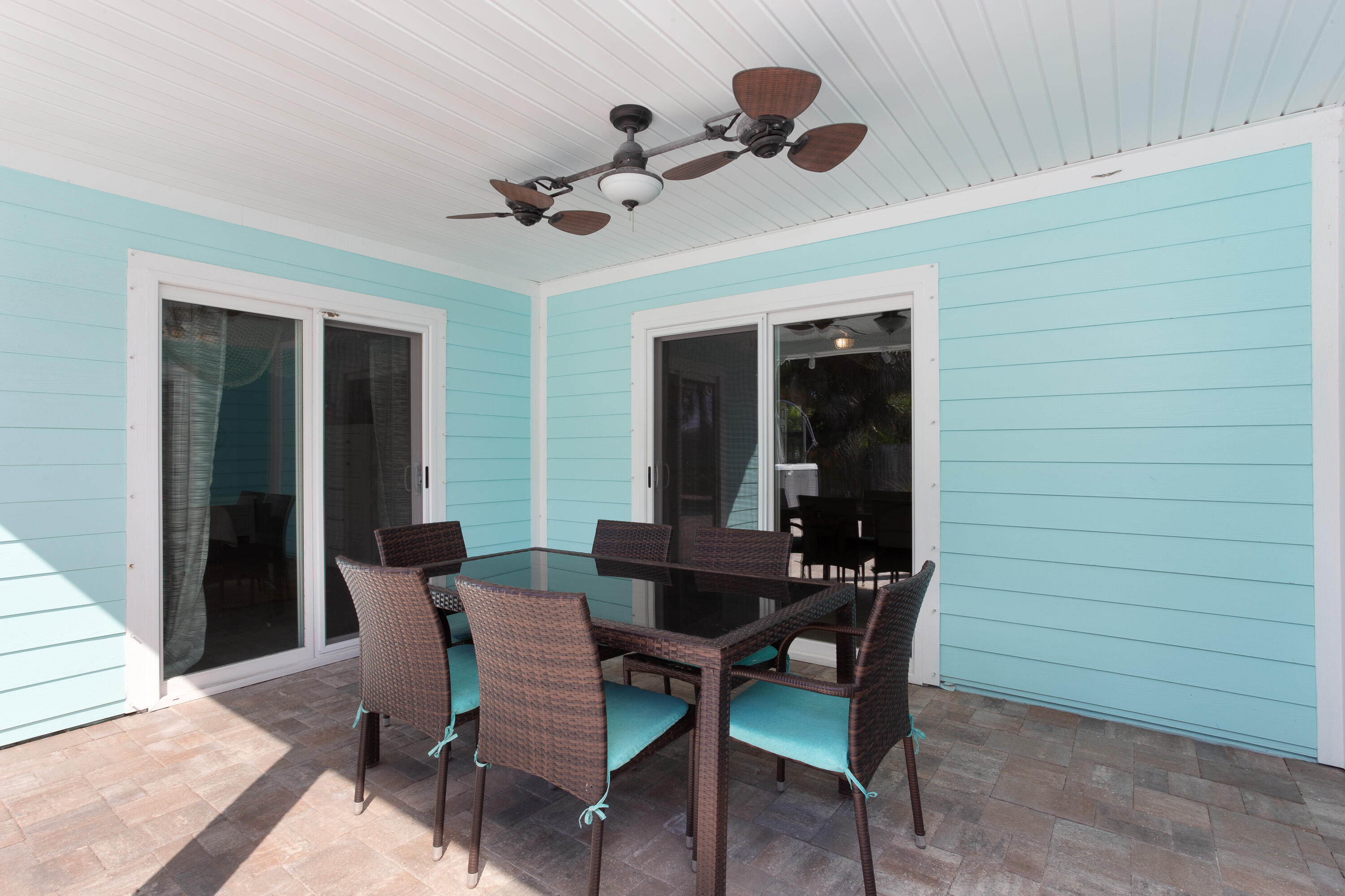 401 Surf Road Melbourne Beach, FL 32951 - Photo 57 of 94 a view of a dining room with furniture and chandelier