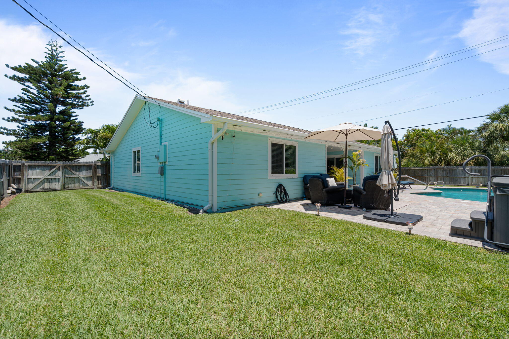 401 Surf Road Melbourne Beach, FL 32951 - Photo 83 of 94 a view of a house with backyard and sitting area