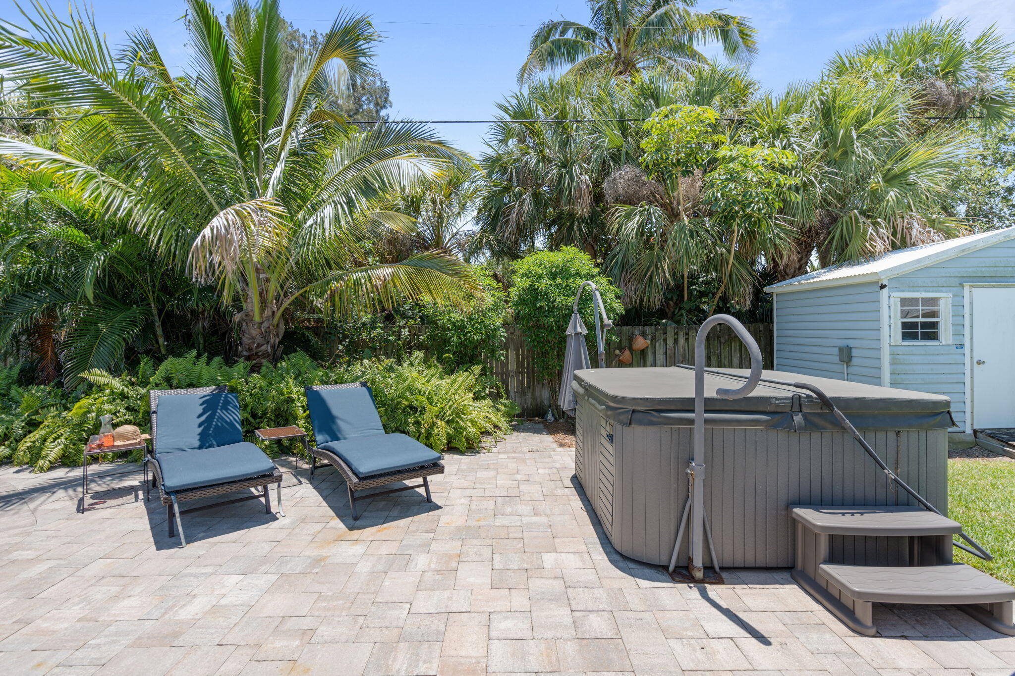 401 Surf Road Melbourne Beach, FL 32951 - Photo 86 of 94 a view of a chairs and table in the backyard
