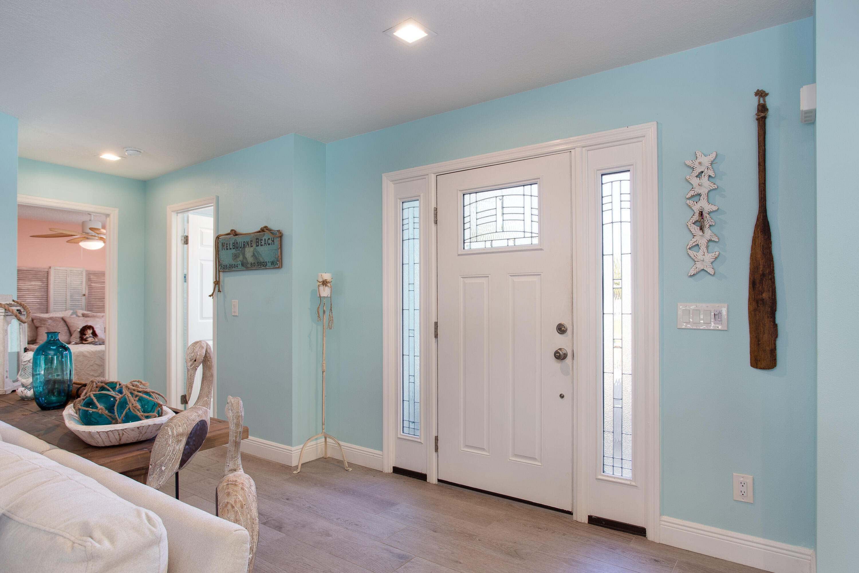401 Surf Road Melbourne Beach, FL 32951 - Photo 9 of 94 a living room with furniture and potted plant