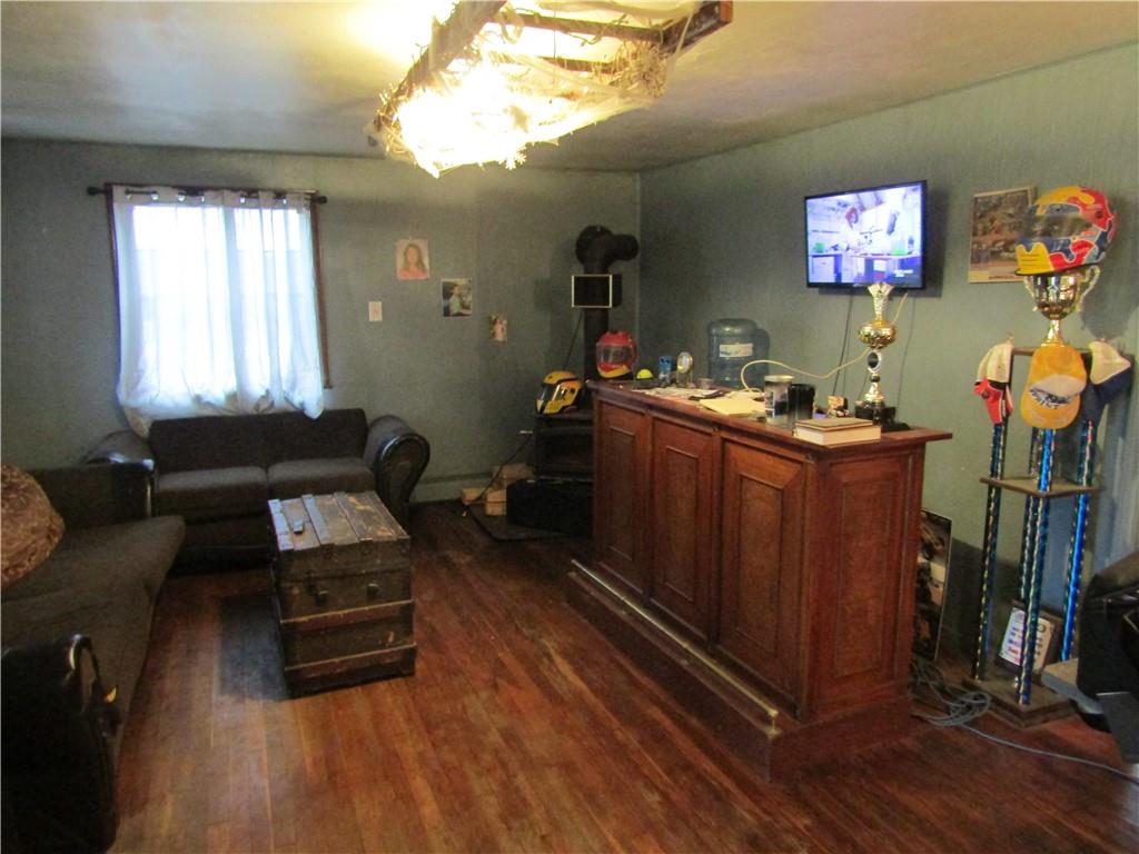 1177 Bend Road Mercer, PA 16137 - Photo 3 of 9 a bedroom with furniture and a flat screen tv