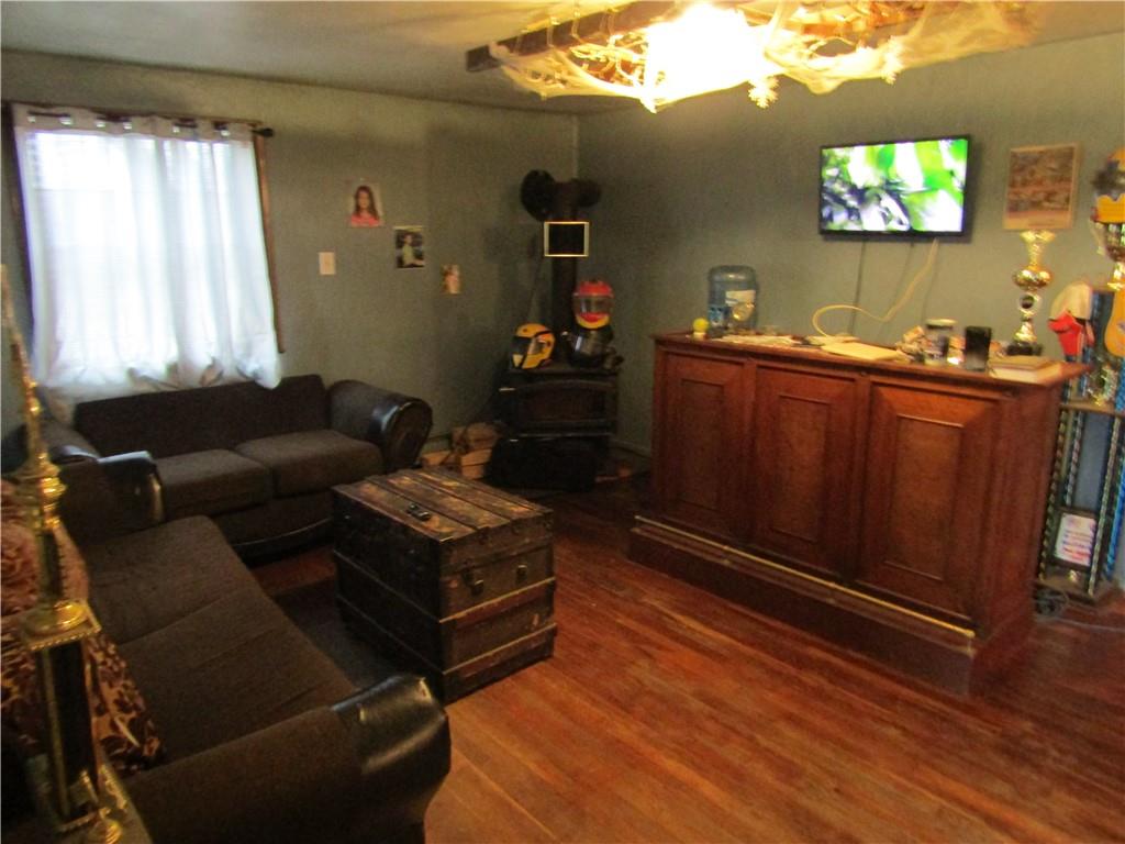 1177 Bend Road Mercer, PA 16137 - Photo 4 of 9 a living room with furniture and a flat screen tv