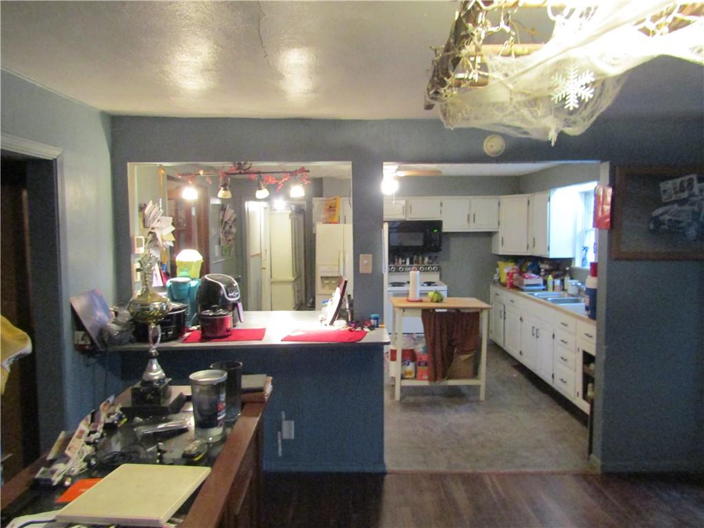 1177 Bend Road Mercer, PA 16137 - Photo 5 of 9 a kitchen filled with a white stove top oven and cabinets