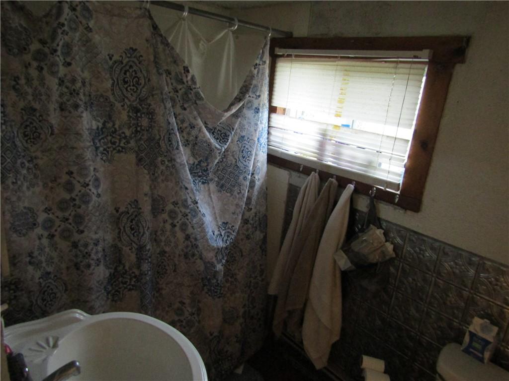 1177 Bend Road Mercer, PA 16137 - Photo 9 of 9 a bathroom with a toilet and a sink