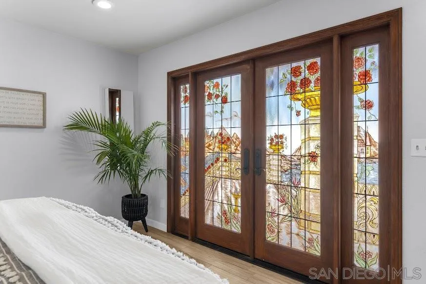 156 Little Oaks Road Encinitas, CA 92024 - Photo 12 of 38 a potted plant sitting in front of a window