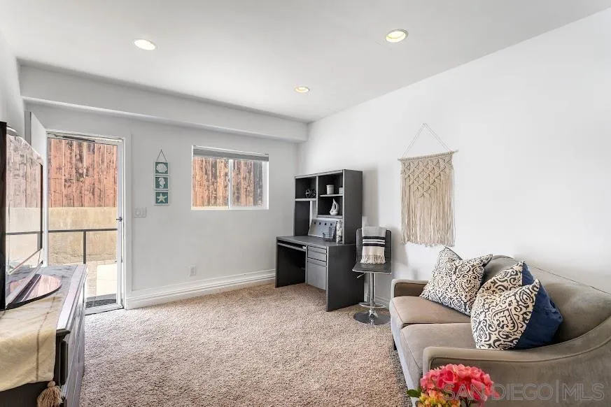 156 Little Oaks Road Encinitas, CA 92024 - Photo 18 of 38 a living room with furniture and a flat screen tv