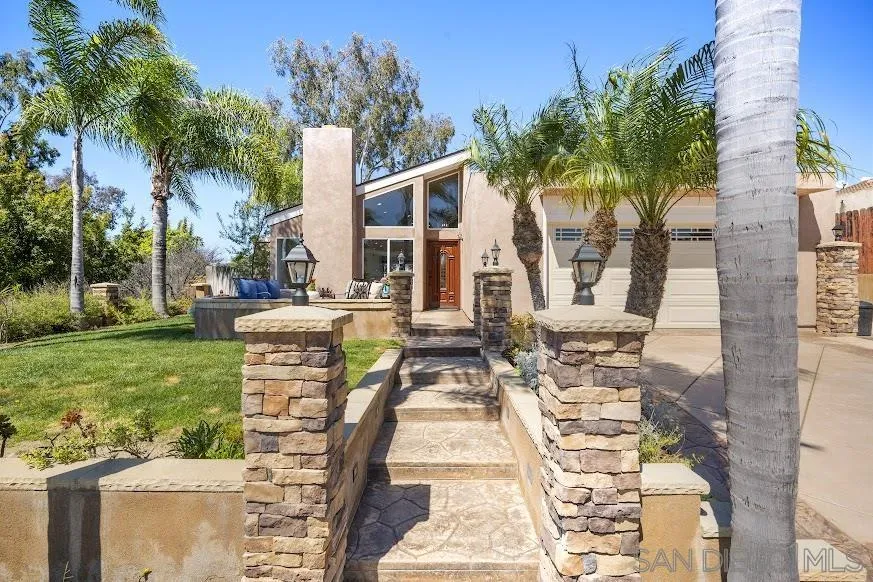 156 Little Oaks Road Encinitas, CA 92024 - Photo 20 of 38 a view of a patio with couches table and chairs and potted plants