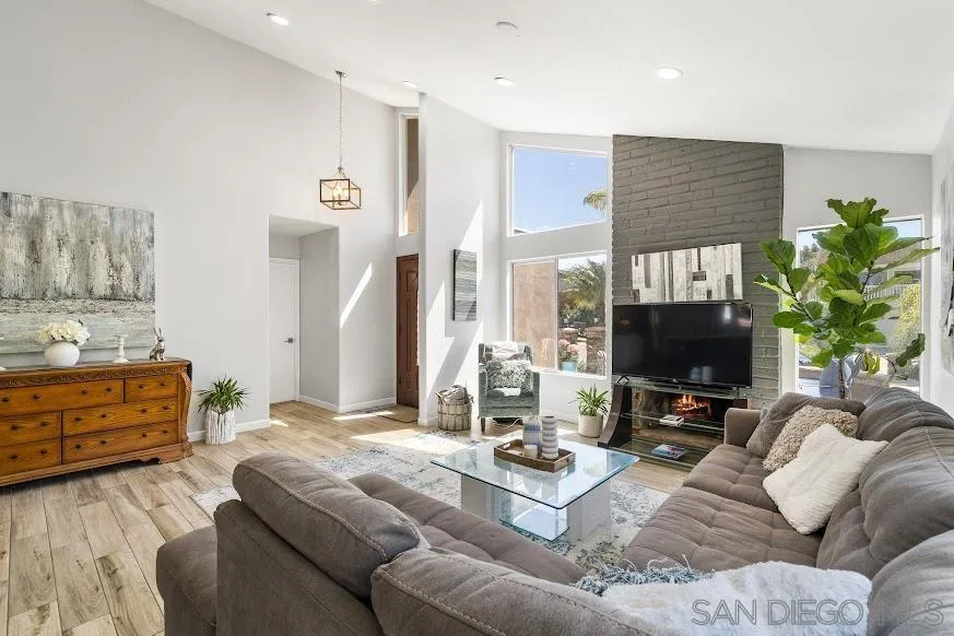156 Little Oaks Road Encinitas, CA 92024 - Photo 3 of 38 a living room with furniture and a flat screen tv