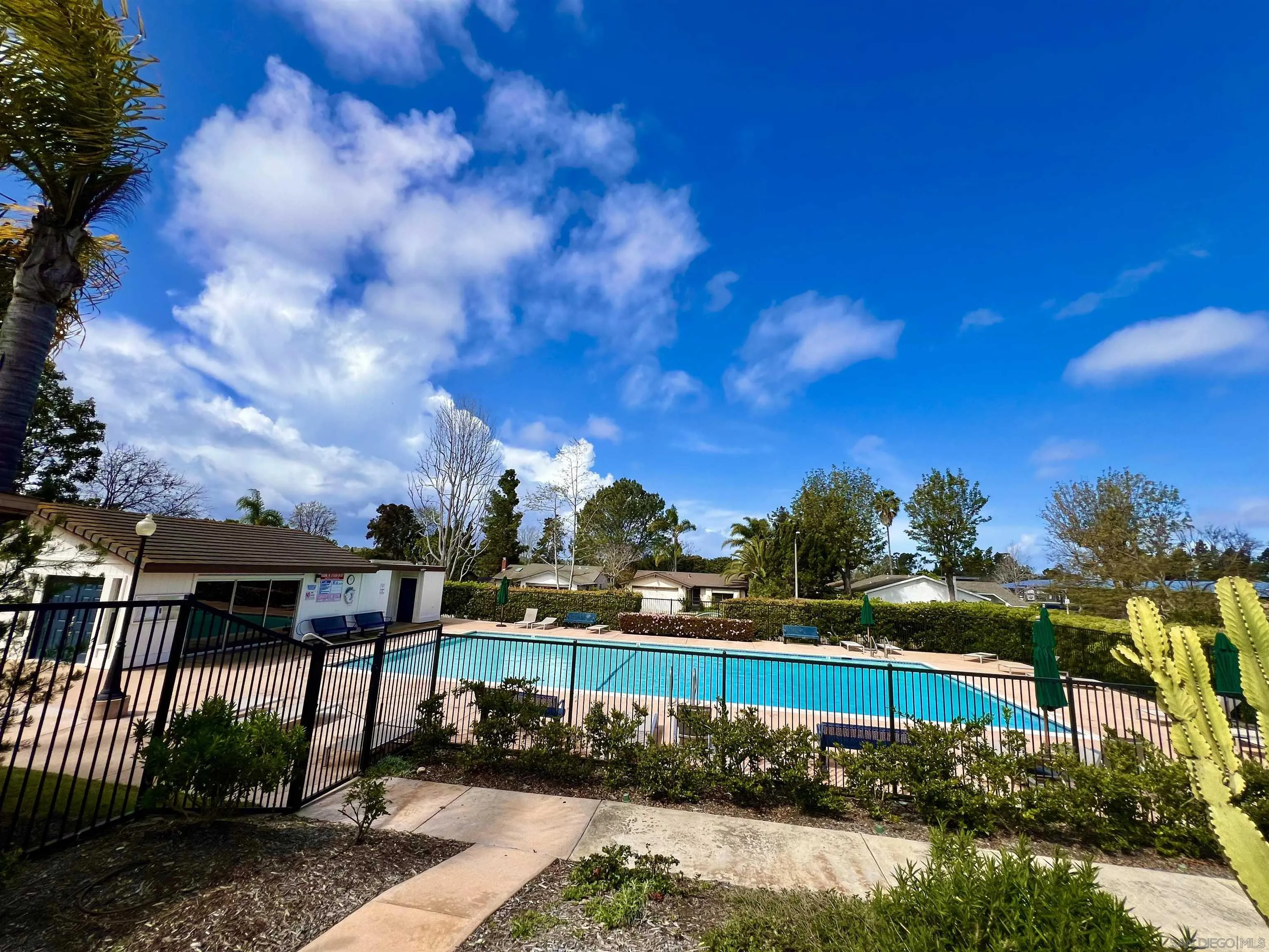 156 Little Oaks Road Encinitas, CA 92024 - Photo 38 of 38 a view of a lake with a house in the background