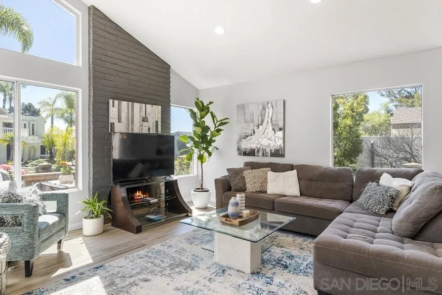 156 Little Oaks Road Encinitas, CA 92024 - Photo 4 of 38 a living room with furniture a flat screen tv and a large window