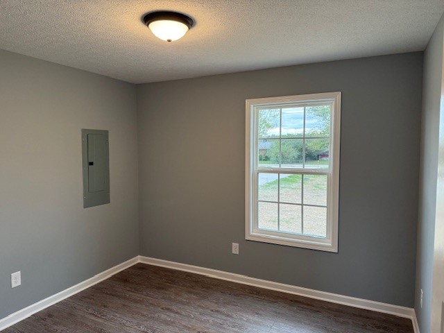 1415 Old Estill Springs Road Tullahoma, TN 37388 - Photo 13 of 25 an empty room with wooden floor and windows