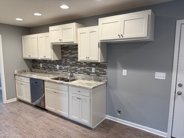 1415 Old Estill Springs Road Tullahoma, TN 37388 - Photo 8 of 25 a kitchen with stainless steel appliances granite countertop a sink and cabinets