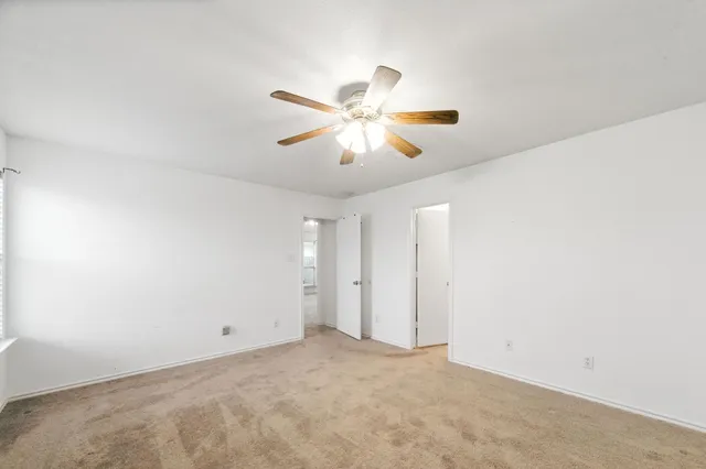 a view of a big room with carpet
